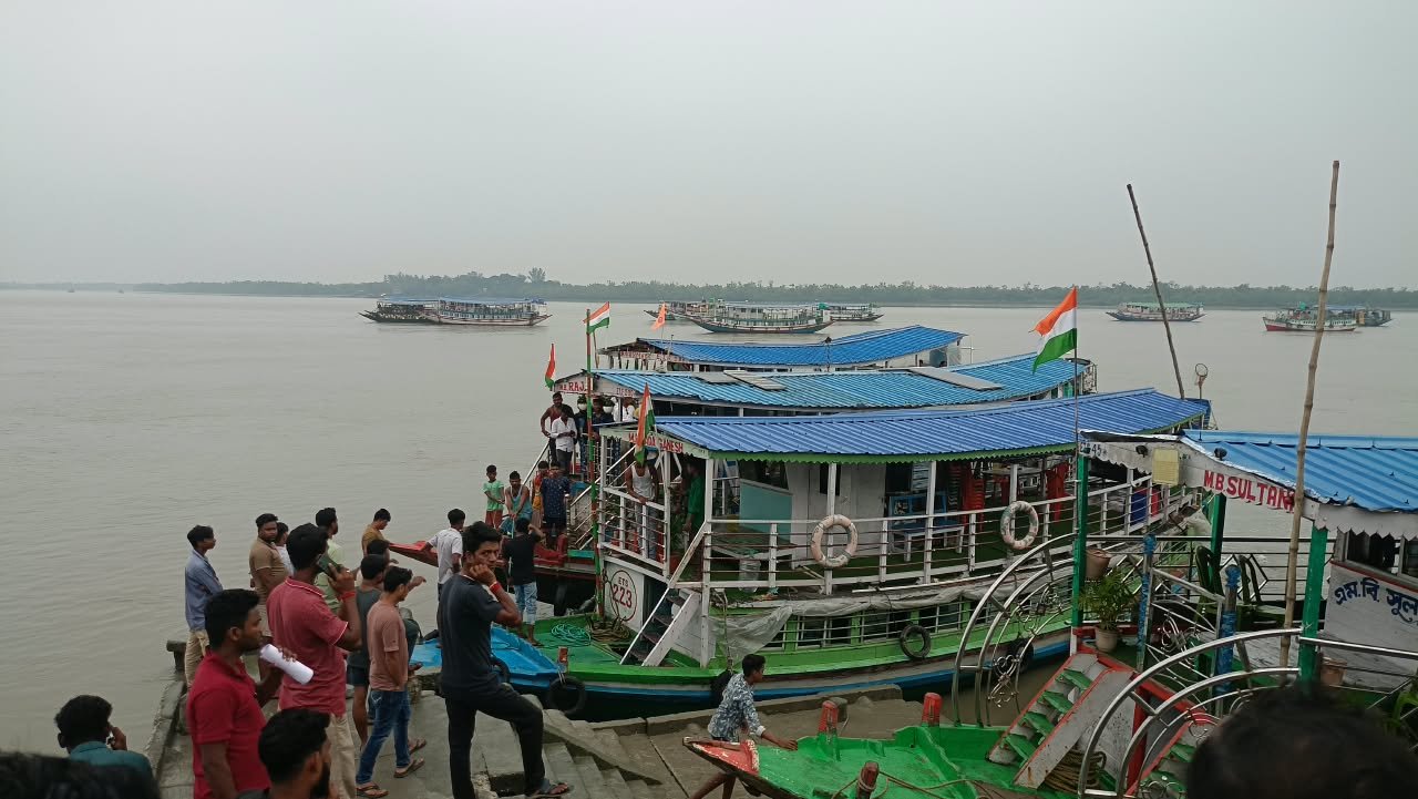Tourists clicking photos from boat deck